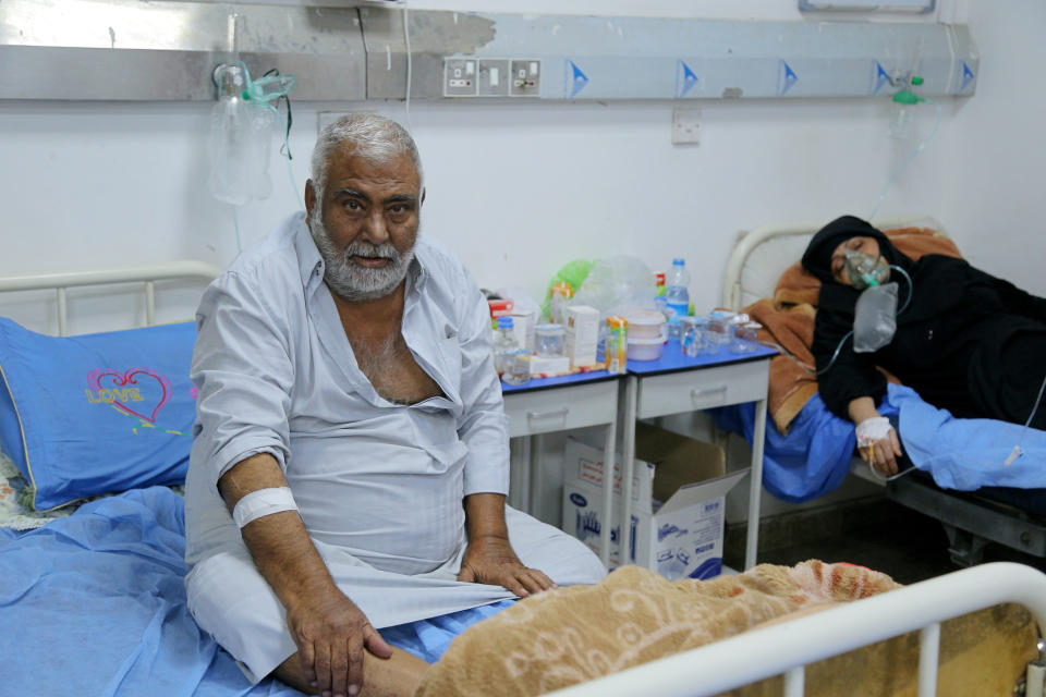 Coronavirus patients receive treatment at a hospital in Najaf, Iraq, Wednesday, July 14, 2021. Infections in Iraq have surged to record highs amid a third wave spurred by the more aggressive delta variant, and long-neglected hospitals suffering the effects of decades of war are overwhelmed with severely ill patients. (AP Photo/Anmar Khalil)