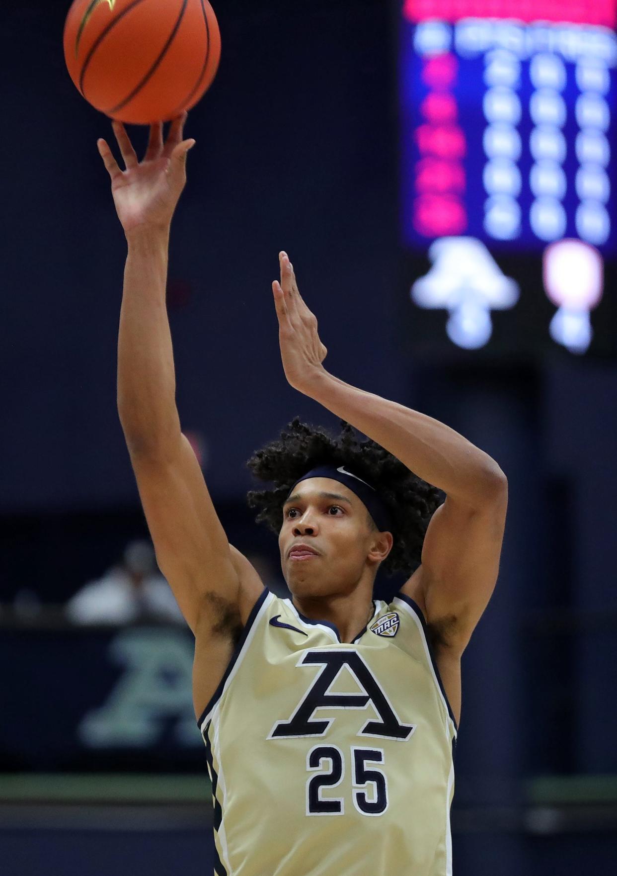 Akron Zips forward Enrique Freeman (25) attempts a shot during the first half of an NCAA college basketball game, Tuesday, Dec. 5, 2023, in Akron, Ohio.