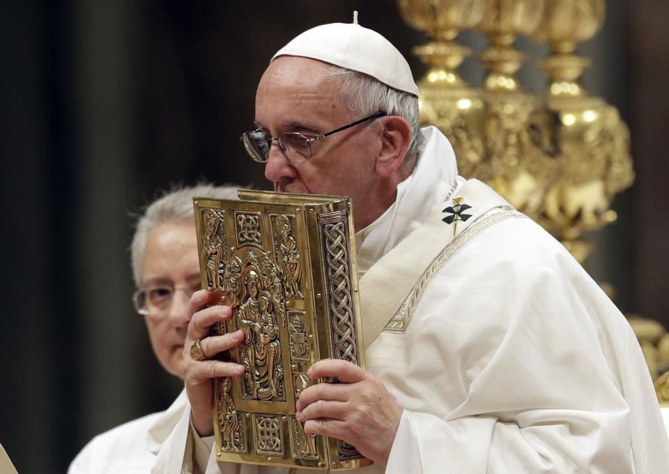 Pope Francis presides over a solemn Easter vigil ceremony in St. Peter's Basilica at the Vatican, Saturday, April 15, 2017. (AP Photo/Andrew Medichini)