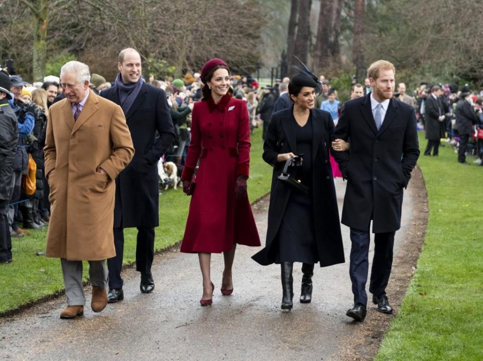 The bios of Prince Harry and Meghan Markle (far right) are placed beneath a dozen other members of the royal family. UK Press via Getty Images