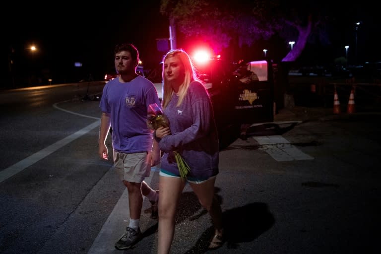 Well-wishers arrived with bouquets of flowers to pay their respects for the victims of the Santa Fe High School shooting in Texas deep into the night, many hours after the incident