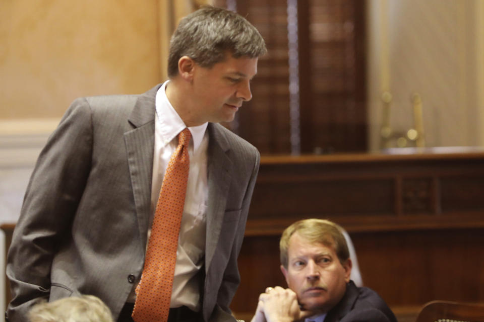 Republican South Carolina Majority Leader Shane Massey, standing, and Republican Sen. Shane Martin, sitting, listen during debate on a bill banning abortion on Wednesday, Sept. 7, 2022, in Columbia, S.C. (AP Photo/Jeffrey Collins)