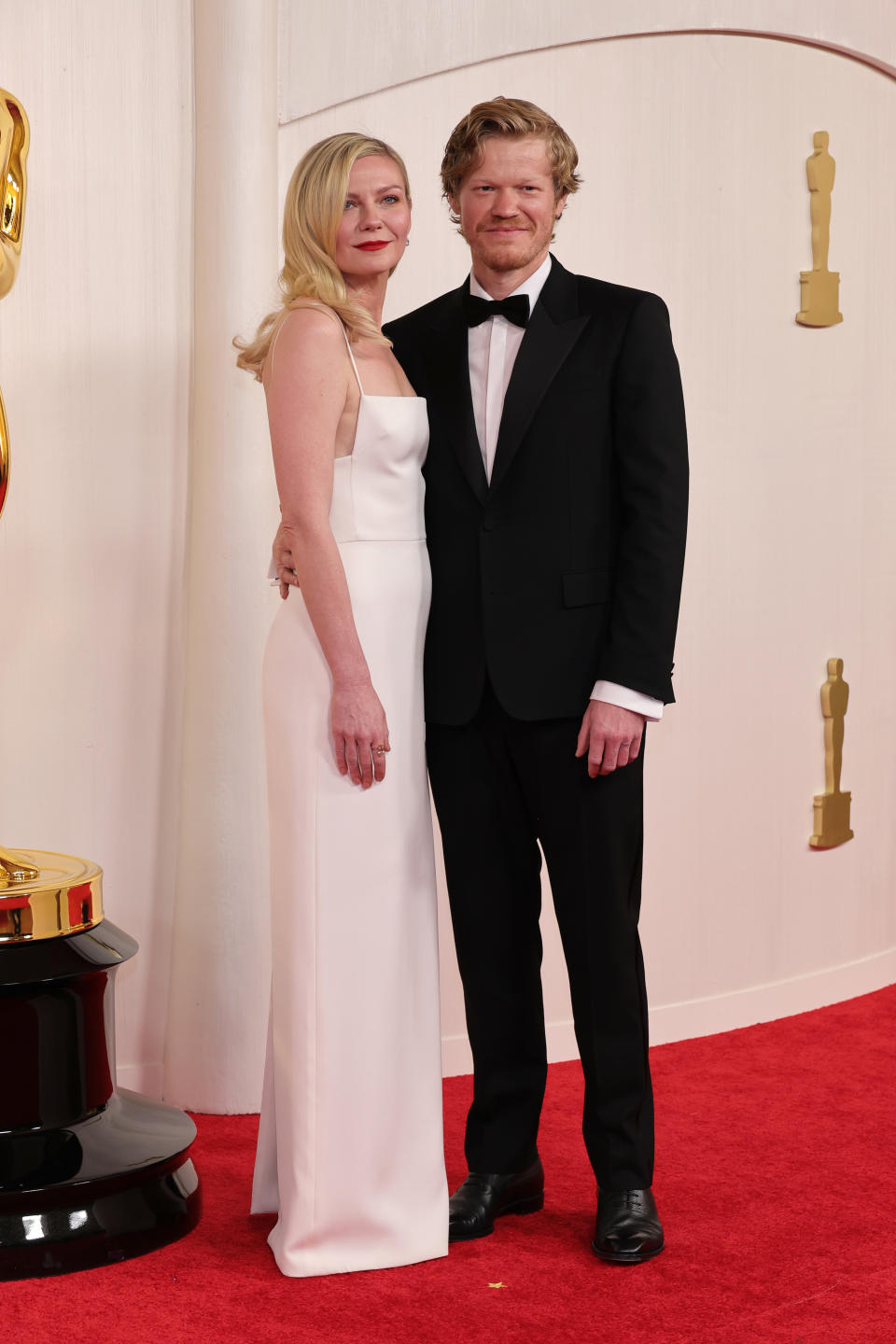 Kirsten Dunst and Killers of the Flower Moon star Jesse Plemons pose together on the carpet. Photo: Getty