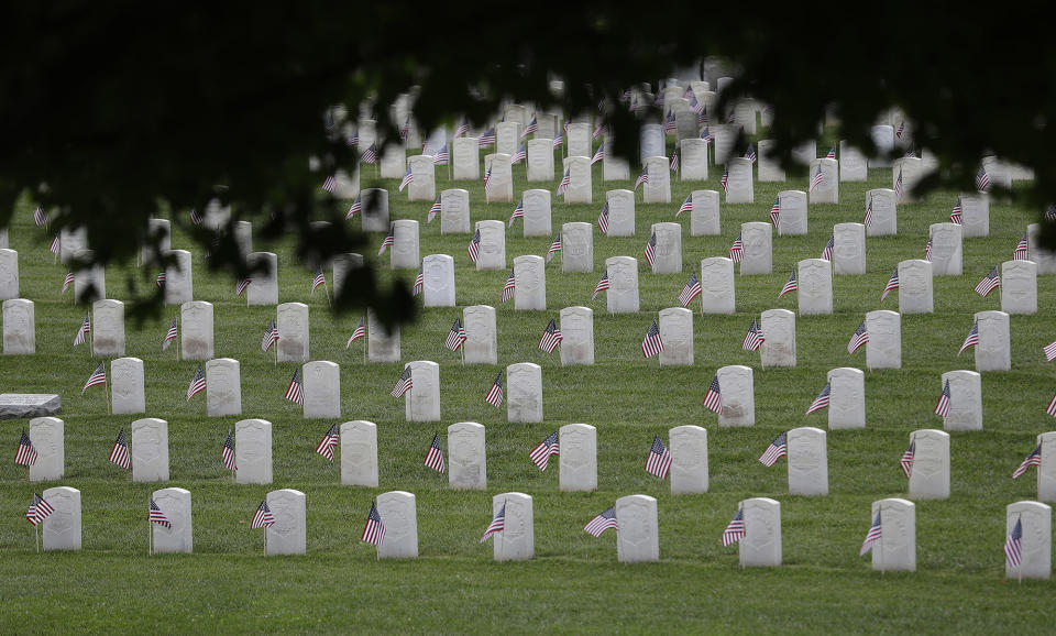<p>American flags fly next to veterans’ graves ahead of Memorial Day at the Crown Hill National Cemetery, May 28, 2016, in Indianapolis. (AP Photo/Darron Cummings) </p>