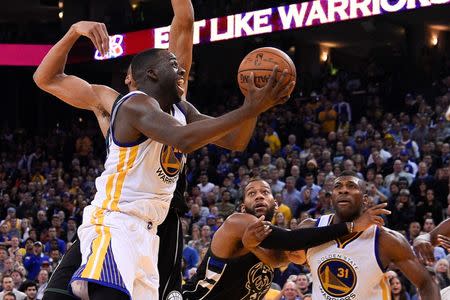 December 18, 2015; Oakland, CA, USA; Golden State Warriors forward Draymond Green (23) shoots the basketball against the Milwaukee Bucks during the fourth quarter at Oracle Arena. The Warriors defeated the Bucks 121-112. Mandatory Credit: Kyle Terada-USA TODAY Sports