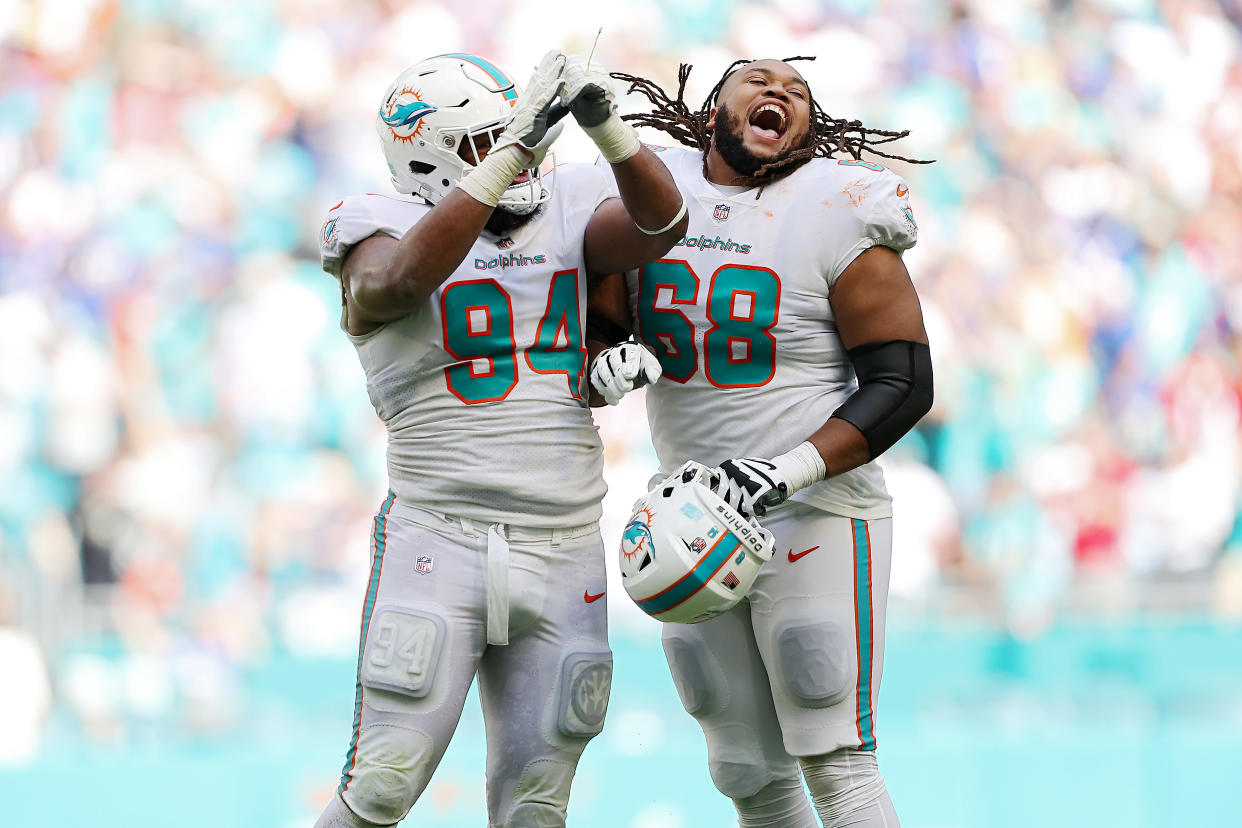 Christian Wilkins (94) and Robert Hunt (68) of the Miami Dolphins celebrate during a huge win over the Bills. (Photo by Megan Briggs/Getty Images)