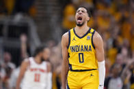 Indiana Pacers guard Tyrese Haliburton celebrates after making a three-point basket during the first half of Game 3 against the New York Knicks in an NBA basketball second-round playoff series, Friday, May 10, 2024, in Indianapolis. (AP Photo/Michael Conroy)