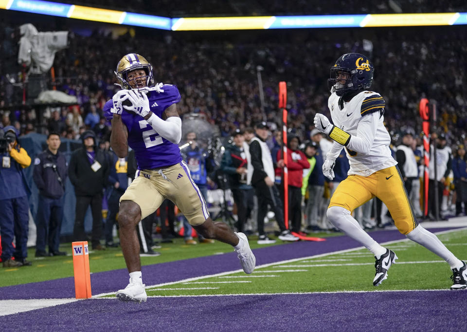 Washington wide receiver Ja'Lynn Polk (2) makes a touchdown reception against California defensive back Jeremiah Earby during the first half of an NCAA college football game Saturday, Sept. 23, 2023, in Seattle. (AP Photo/Lindsey Wasson)