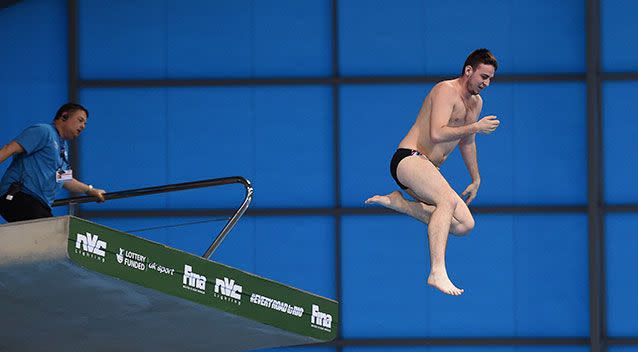 Prankster takes the plunge, prompting a wave of boos from spectators. Photo: Getty