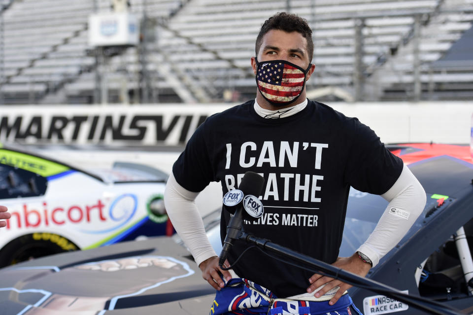 MARTINSVILLE, VIRGINIA - JUNE 10: Bubba Wallace, driver of the #43 Richard Petty Motorsports Chevrolet, wears a "I Can't Breathee - Black Lives Matter" t-shirt under his fire suit in solidarity with protesters around the world taking to the streets after the death of George Floyd on May 25, speaks to the media prior to the NASCAR Cup Series Blue-Emu Maximum Pain Relief 500 at Martinsville Speedway on June 10, 2020 in Martinsville, Virginia. (Photo by Jared C. Tilton/Getty Images)