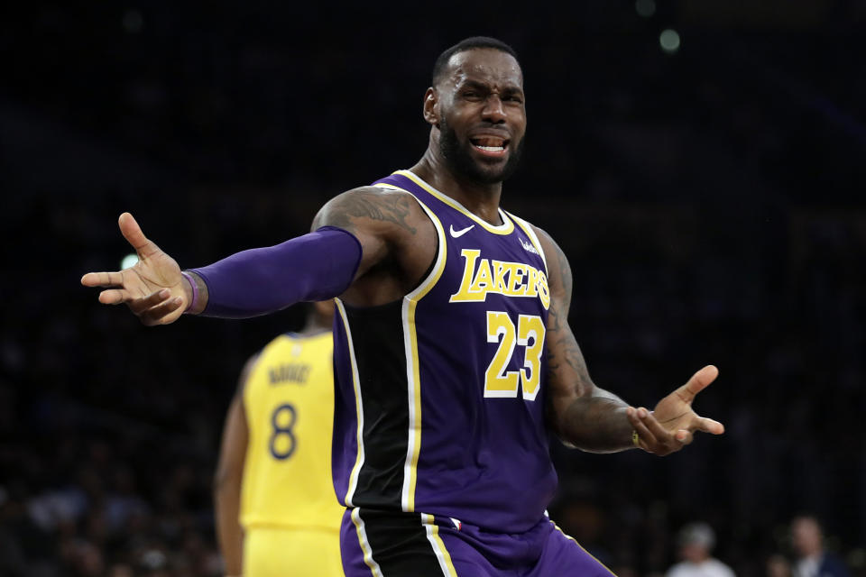 Los Angeles Lakers' LeBron James questions a call during the second half of the team's NBA basketball game against the Golden State Warriors on Wednesday, Nov. 13, 2019, in Los Angeles. (AP Photo/Marcio Jose Sanchez)