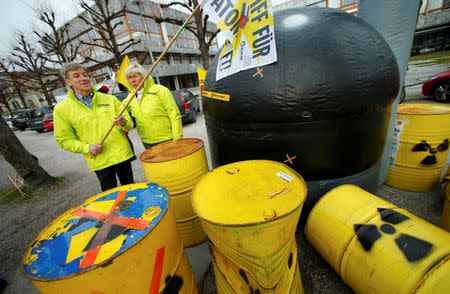 Anti-nuclear protestors demonstrate outside Germany's Constitutional Court in Karlsruhe 15 March 2016, prior to the start of a two-day hearing in a case relating to Germany's landmark decision to shutdown of their nuclear plants by 2022. REUTERS/Staff/Files