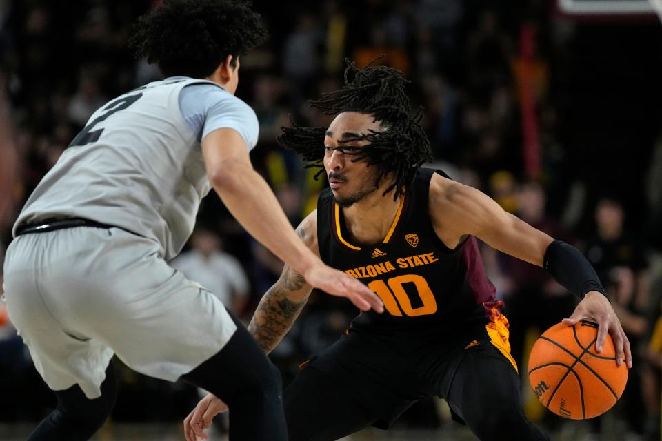 Arizona State guard Frankie Collins (10) drives against Colorado guard KJ Simpson during the second half of an NCAA college basketball game, Feb. 16, 2023, in Tempe, Ariz.