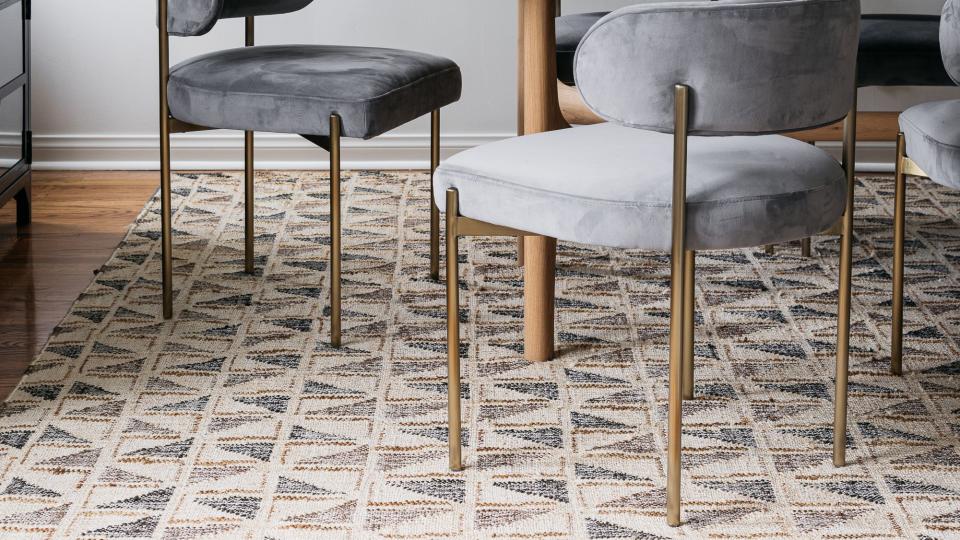 dining room table and chairs with rug underneath