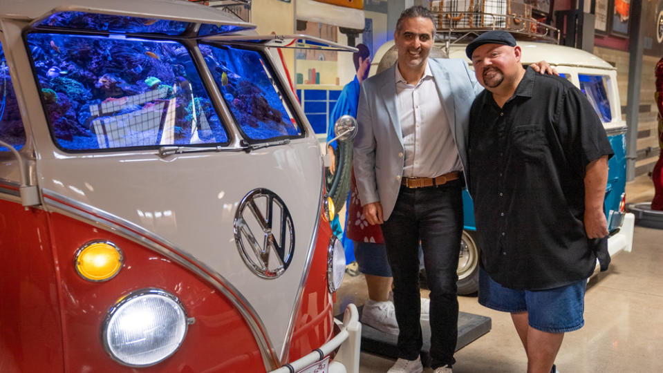Pablo Di Si, Volkswagen Group of America's president and CEO (left), pays comedian Gabriel Iglesias and his VW collection a visit.