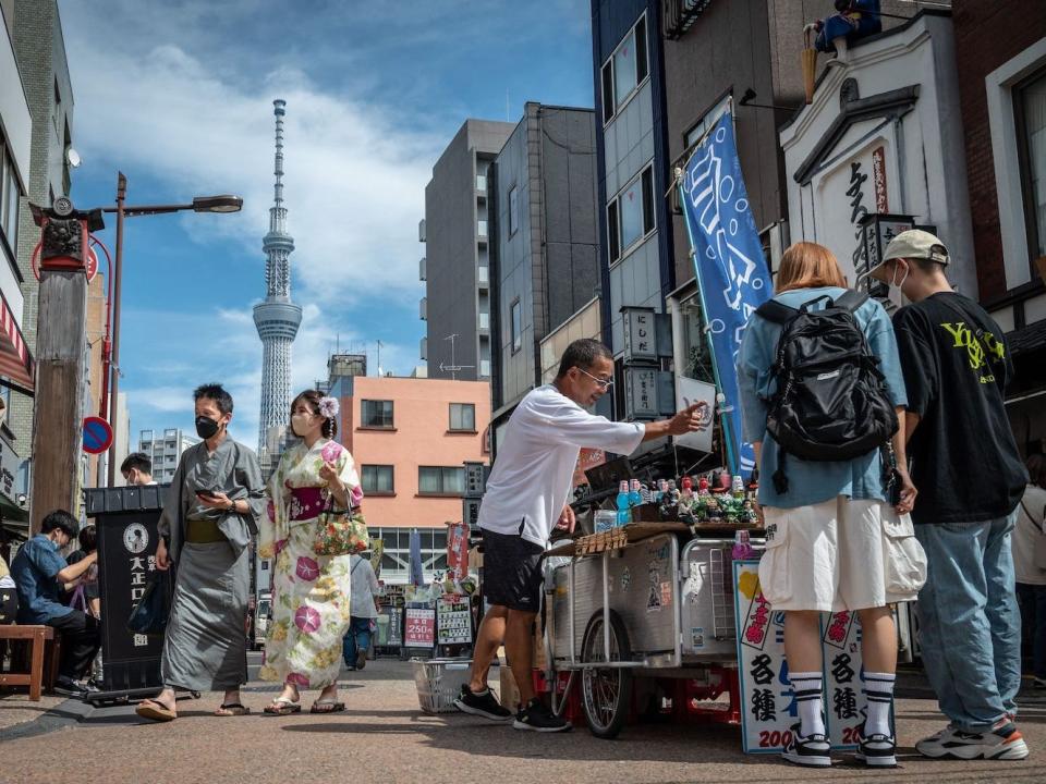 People visit the Asakusa area in Tokyo, Japan.