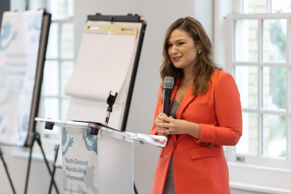 Abby Finkenauer, special envoy for the State Department's Global Youth Issues Office, speaks at an event for the U.S. Institute of Peace last June.