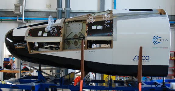 European Space Agency’s Intermediate Experimental Vehicle, a robotic space plane prototype, is shown under construction.