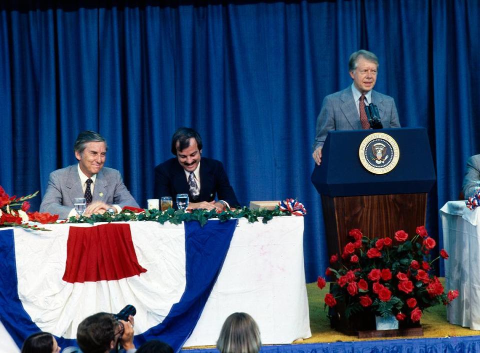 President Jimmy Carter speaks at a podium at Tarrant County Convention Center on June 23, 1978. Star-Telegram Executive Editor Jack Tinsley is seated directly left of Carter, with Sen. Lloyd Bentsen of Texas next to him.