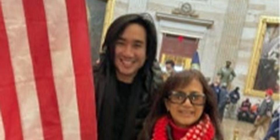 Accused Capitol rioter Antony Vo and his mother stand with US flag