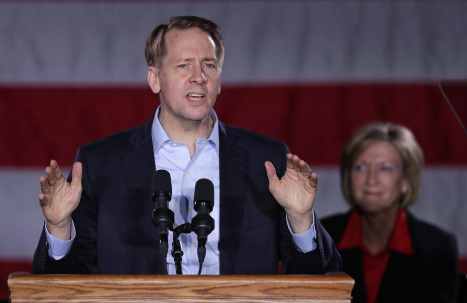 Democratic gubernatorial candidate Richard Cordray speaks at the Kilcawley Center at Youngstown State University, Monday, Oct. 29, 2018, in Youngstown, Ohio. Cordray's running mate Betty Sutton, right, listens. (AP Photo/Tony Dejak)