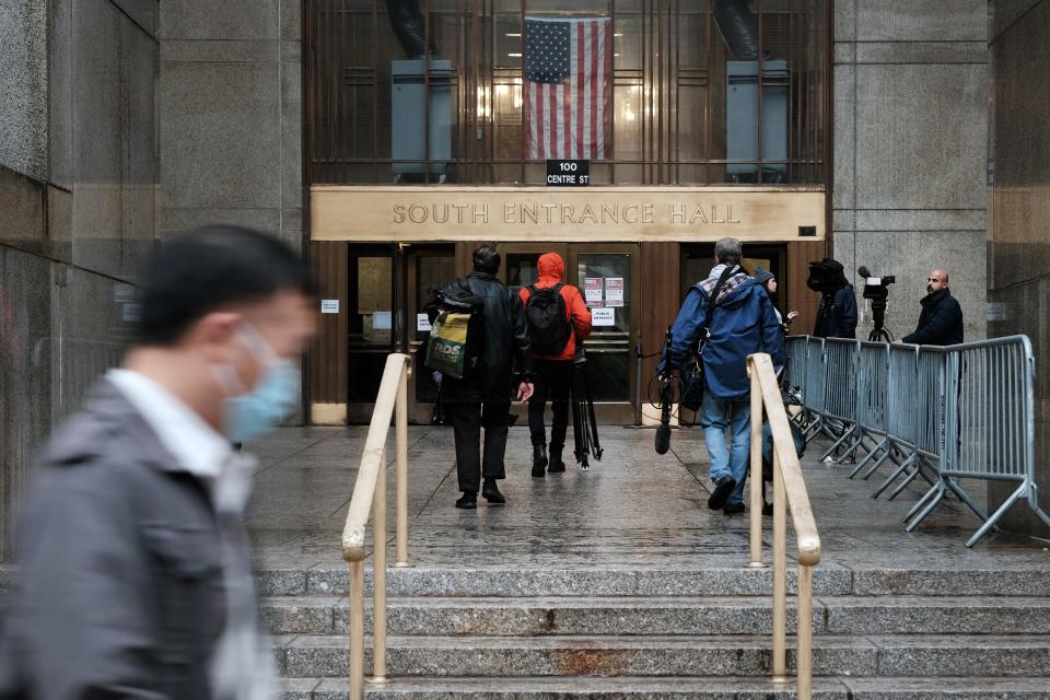 People walk by New York State Supreme Court building