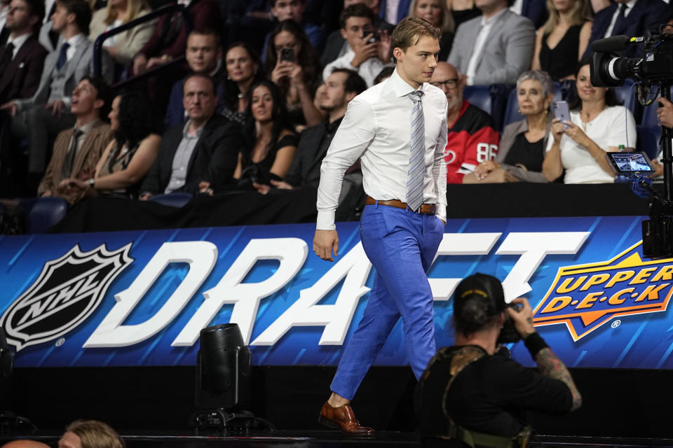 Chicago Blackhawks first round draft pick Connor Bedard makes his way to the stage during the first round of the NHL hockey draft, Wednesday, June 28, 2023, in Nashville, Tenn. (AP Photo/George Walker IV)