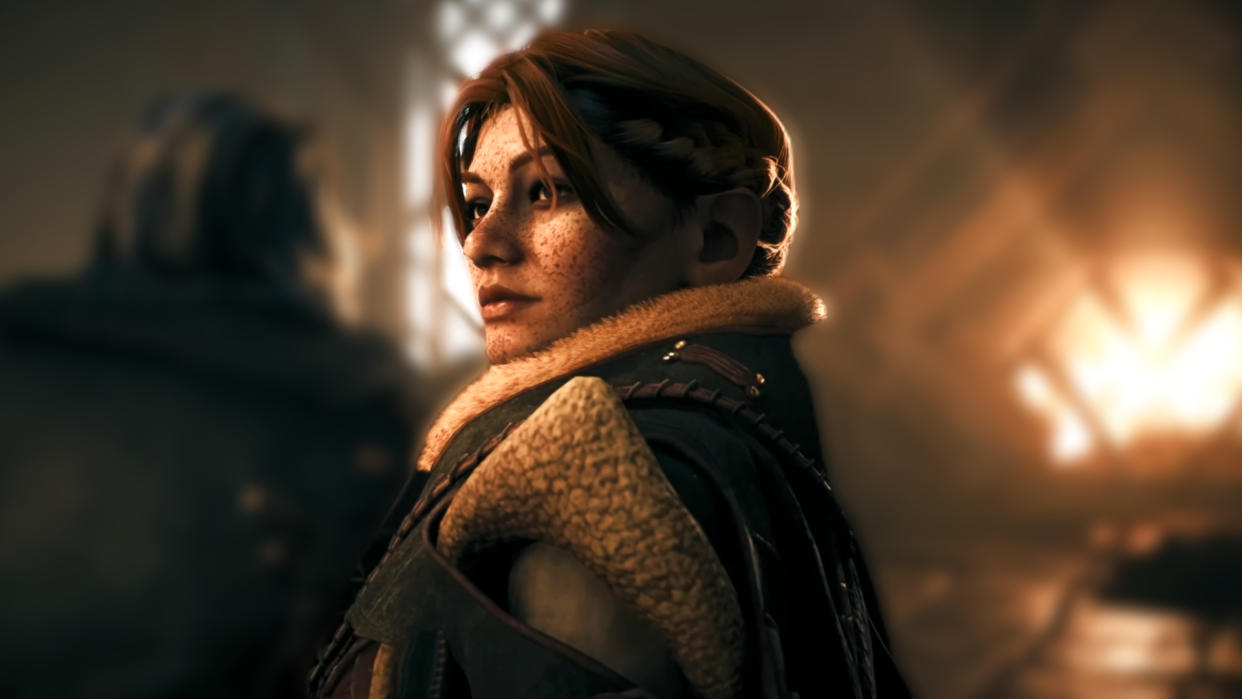  Dragon Age: The Veilguard reveal trailer screenshot showing Lace Harding, a dwarven woman with long red hair and a freckled face. 