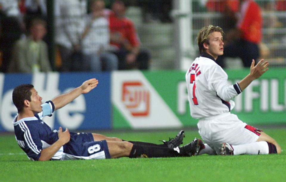 David Beckham looks up as he is sent off for kicking out at Diego Simeone in 1998