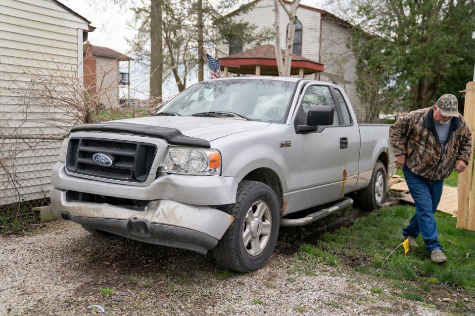 Ed Wenderski, 72, of Newport walks away from his son's truck on Sunday, April 21, 2024 where an alleged drunk driver hit the truck before she smashed through a wall at the Swan Boat Club just down the gravel drive during a child's birthday party in Newport on Saturday.