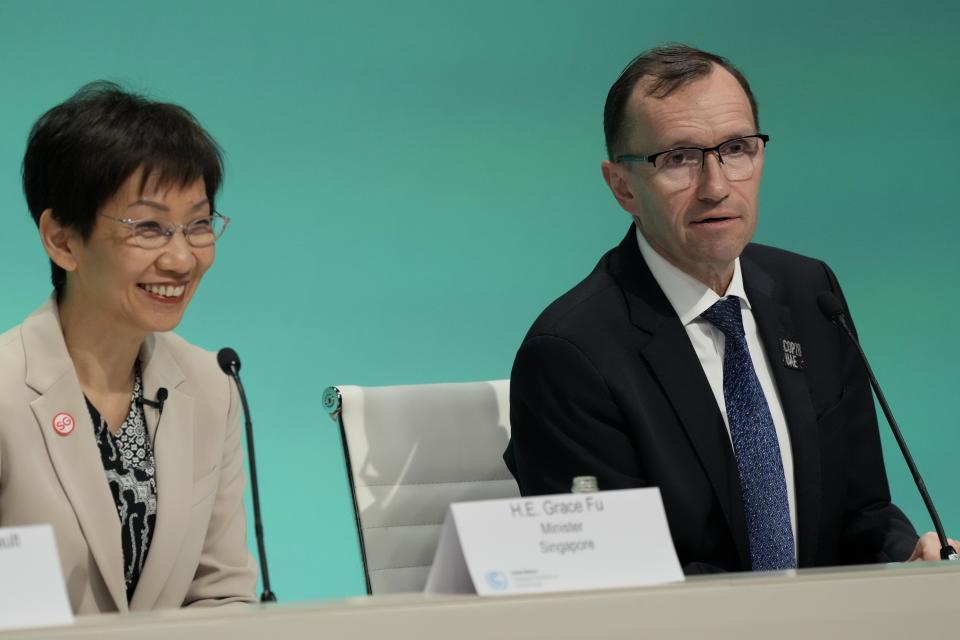 Espen Barth Eide, right, minister for climate and environment of Norway, and Grace Fu, minister of environment for Singapore, attend a news conference at the COP28 U.N. Climate Summit, Friday, Dec. 8, 2023, in Dubai, United Arab Emirates. (AP Photo/Peter Dejong)