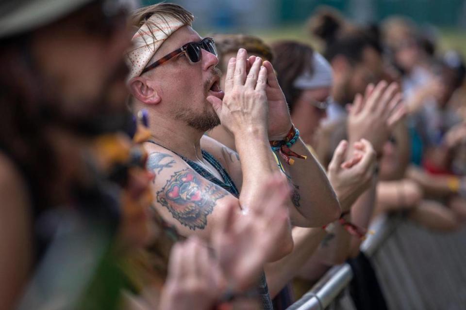 Fans cheer as John Moreland performs at the Railbird Festival at Keeneland in Lexington on Aug. 28. Fans had to show proof of vaccination or a negative test to get in but were not required to wear a mask.