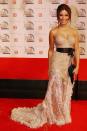 Home and Away stunner Ada Nicodemou wore this laced nude strapless gown to the 2006 Logies with a massive black belt around her waist.