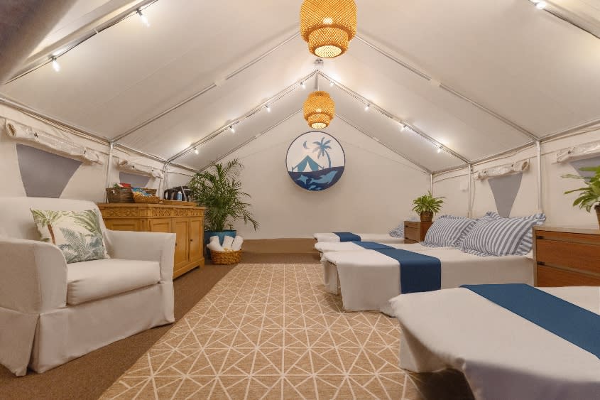 All tents are furnished with plush upholstery and cushioned cots made up with the resort’s signature bedding. - Credit: Atlantis Paradise Island