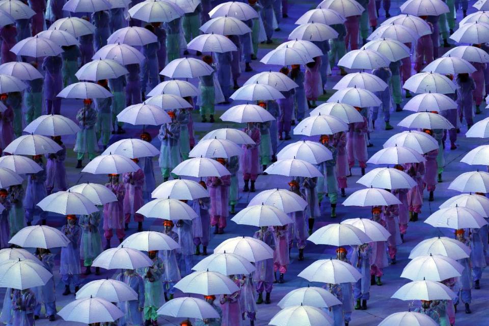 Performers with umbrellas during the Opening Ceremony for the 2012 Paralympics in London, Wednesday Aug. 29, 2012. (AP Photo/Lefteris Pitarakis)