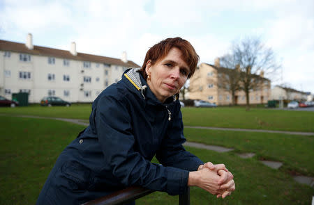 A researcher for "My Country; a work in progress", Sarah Blowers, poses for a photograph on the Matson housing estate, in Gloucester. REUTERS/Peter Nicholls