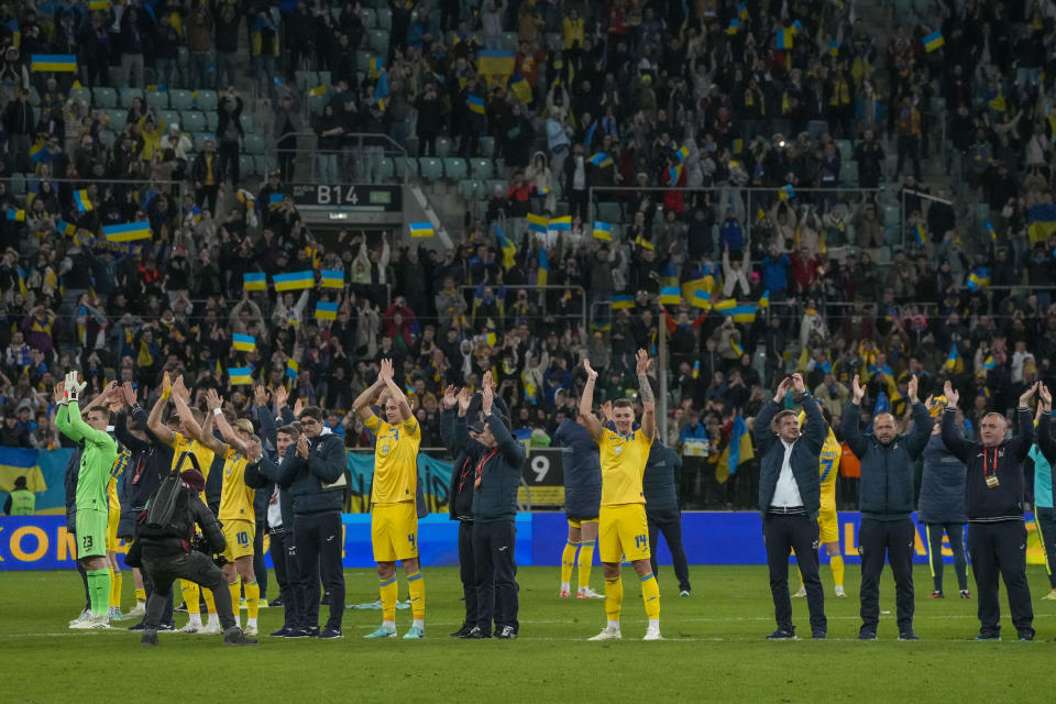 Ukraine players celebrate at the end of the Euro 2024 qualifying play-off soccer match between Ukraine and Iceland, at the Tarczynski Arena Wroclaw in Wroclaw, Poland, Tuesday, March 26, 2024. (AP Photo/Czarek Sokolowski)