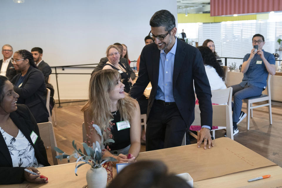 Google CEO Sundar Pichai greets college students during a workshop at the Google office in Washington, Thursday, June 22, 2023. (AP Photo/Jose Luis Magana)
