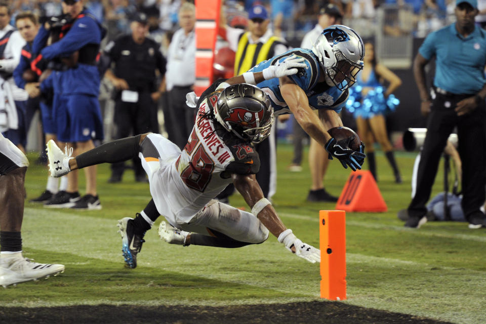 Tampa Bay Buccaneers cornerback Vernon III Hargreaves (28) tackles Carolina Panthers running back Christian McCaffrey late in the second half of an NFL football game in Charlotte, N.C., Friday, Sept. 13, 2019. Tampa Bay won 20-14. (AP Photo/Mike McCarn)