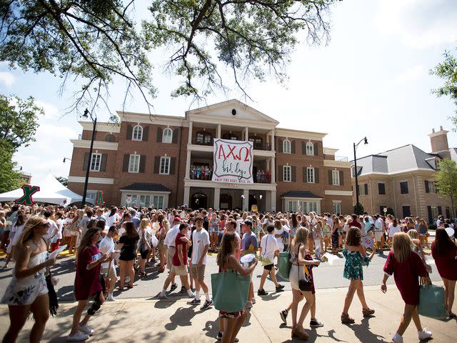 <p>Brynn Anderson/AP</p> College students gather outside of the Alpha Chi Omega house during the University of Alabama sorority recruitment Bid Day, Saturday, Aug. 19, 2017,