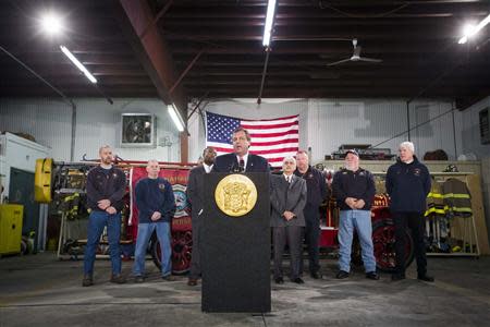 New Jersey Governor Chris Christie speaks to media and homeowners about the ongoing recovery from Hurricane Sandy in Manahawkin, New Jersey January 16, 2014. REUTERS/Lucas Jackson