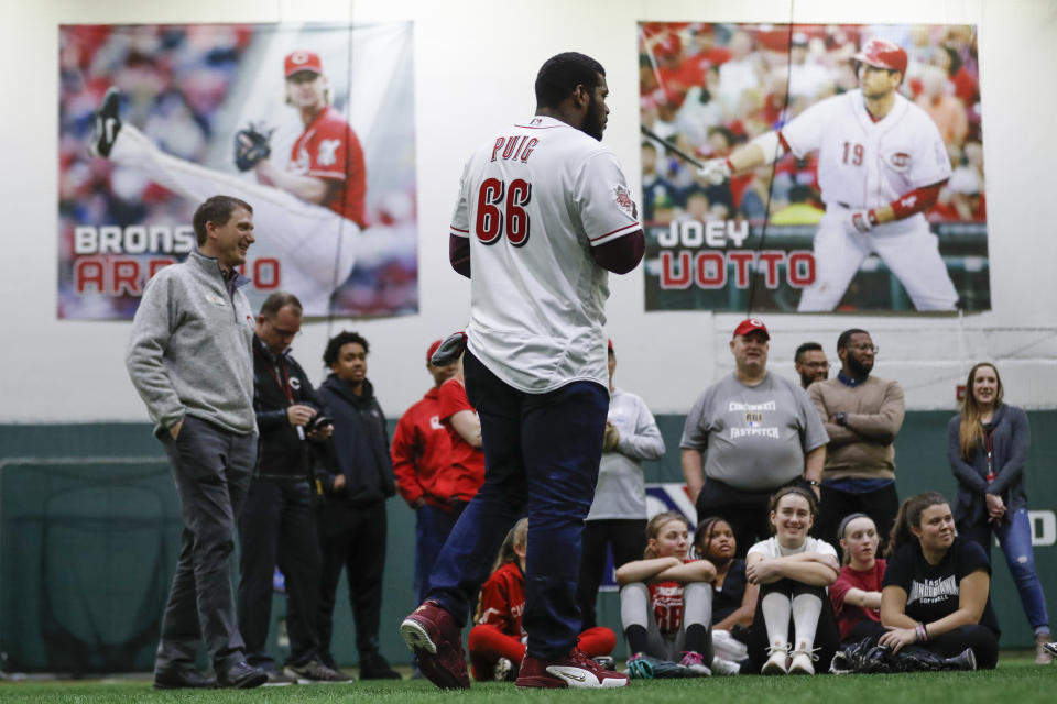 Cincinnati Reds Yasiel Puig takes questions from young athletes during a media availability at the P&G MLB Cincinnati Reds Youth Academy, Wednesday, Jan. 30, 2019, in Cincinnati. (AP Photo/John Minchillo)