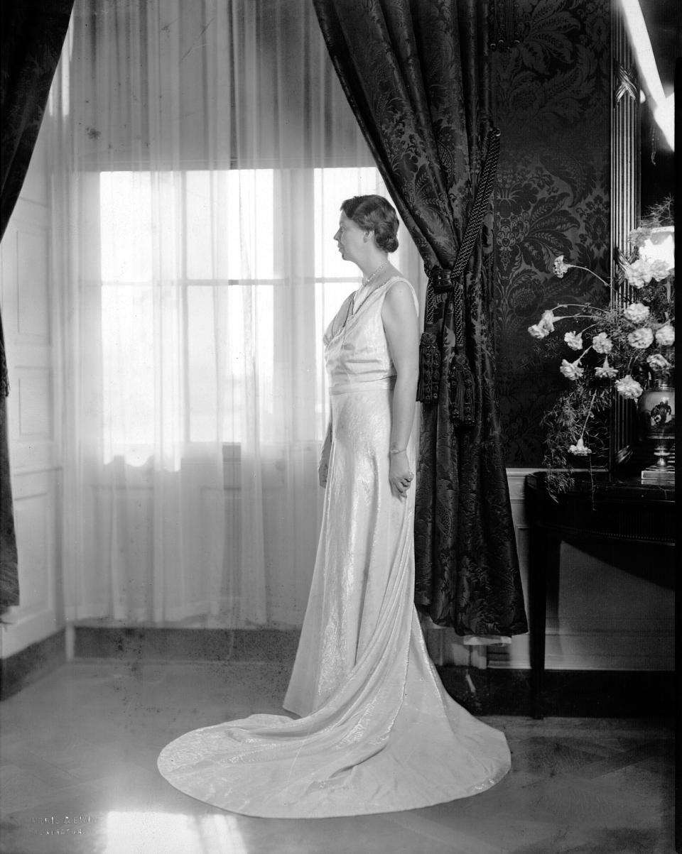 Eleanor Roosevelt posing in the Sally Milgrim gown that she wore to her husband Franklin’s second inaugural festivities in 1937. - Credit: Courtesy White House Historical Association