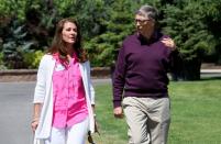 FILE PHOTO: Microsoft technology advisor Bill Gates and his wife Melinda leave on the second day of the Allen and Co. media conference in Sun Valley, Idaho