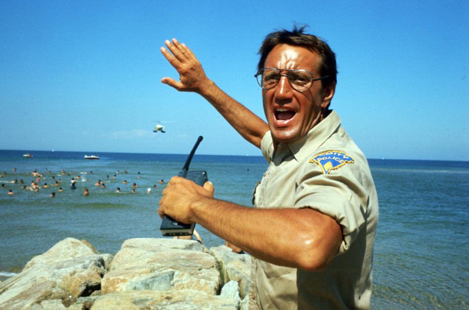 This image released by Universal Pictures shows Roy Scheider in a scene from the iconic 1975 film "Jaws." With all major new releases postponed until at least Labor Day weekend due to the pandemic, summer moviegoing has belonged to the classics. Films like “Jaws,” “E.T.,” “Goonies” and “Ghostbusters” still rank among the summer’s top draws. (Universal Pictures via AP)