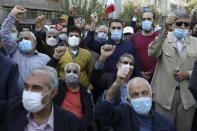 Demonstrators chant slogans in a rally in front of the former U.S. Embassy commemorating the anniversary of its 1979 seizure in Tehran, Iran, Thursday, Nov. 4, 2021. The embassy takeover triggered a 444-day hostage crisis and break in diplomatic relations that continues to this day. (AP Photo/Vahid Salemi)