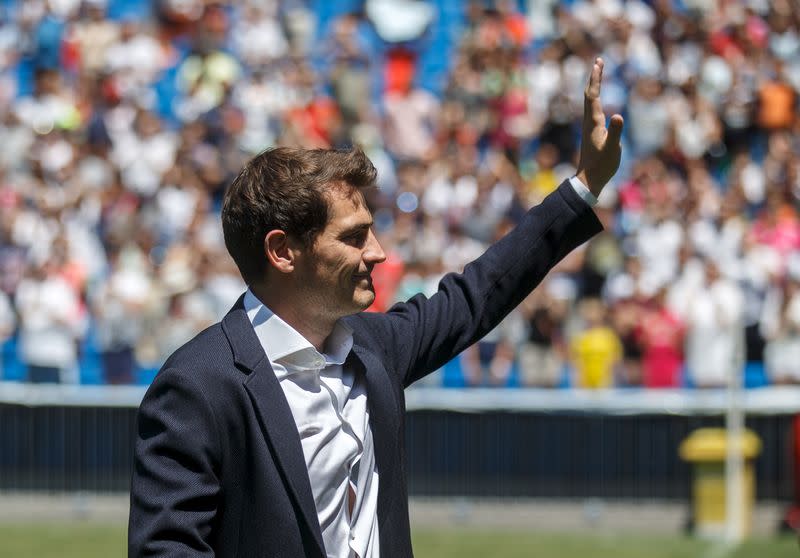 Departing Real Madrid captain and goalkeeper Iker Casillas waves to supporters at official send-off at Bernabeu stadium in Madrid, Spain