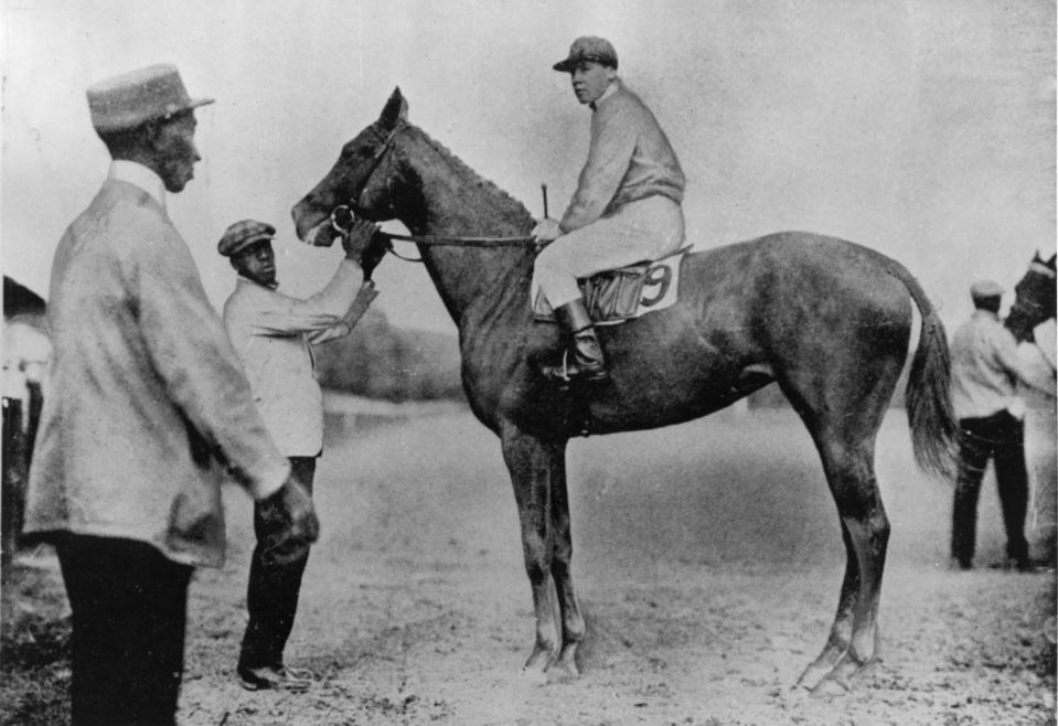 Regret wins the Kentucky Derby at Churchill Downs in 1915.