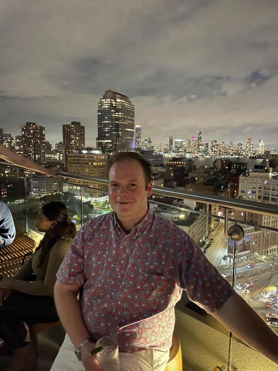 This photo provided by Linda Clary shows her son John Umberger at a rooftop bar in New York, on May 27, 2022. Multiple people, including Umberger, have been fatally poisoned with narcotics in what investigators say were schemes by criminal crews to incapacitate and rob people at New York City bars and nightclubs. (Doug Davenport/Courtesy of Linda Clary via AP)