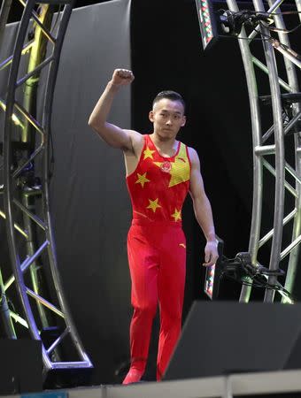 Oct 3, 2017; Montreal, Quebec, CAN; Ruoteng Xiao of People's Republic of China waves to the crowd as he finishes first at the Men's Individual All-Around Final during the 47th FIG Artistic Gymnastics World Championship at Montreal Olympic Stadium. Mandatory Credit: Jean-Yves Ahern-USA TODAY Sports